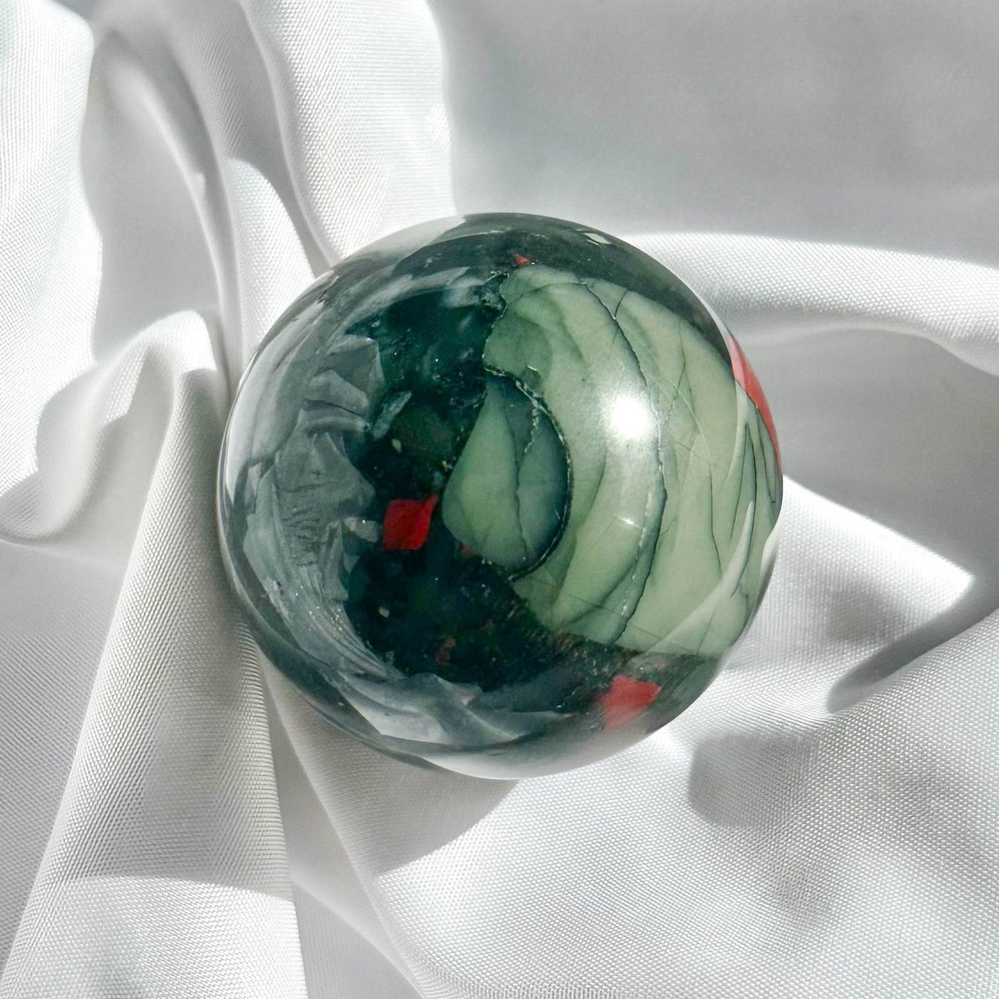Blood Stone is a powerful healing stone that purifies and detoxifies the body. It enhances courage, strength, and vitality.