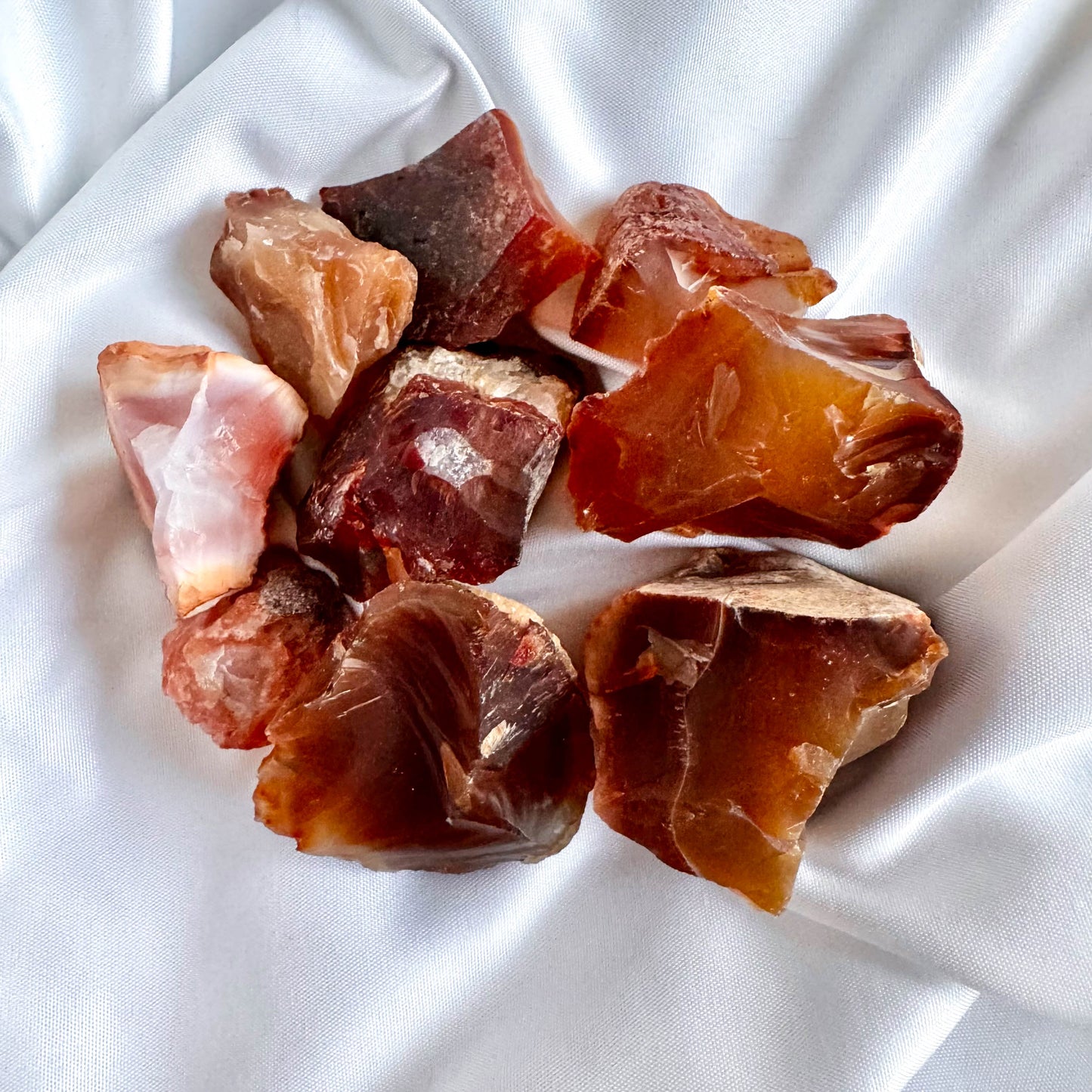 Carnelian is known for its vibrant energy, warmth, and joy. It stimulates creativity, motivation, and endurance.