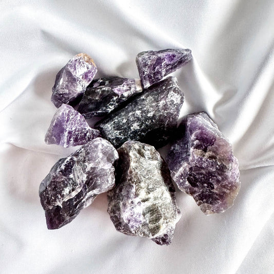 Dream Amethyst, a combination of amethyst and white quartz, enhances dreams and intuition.
