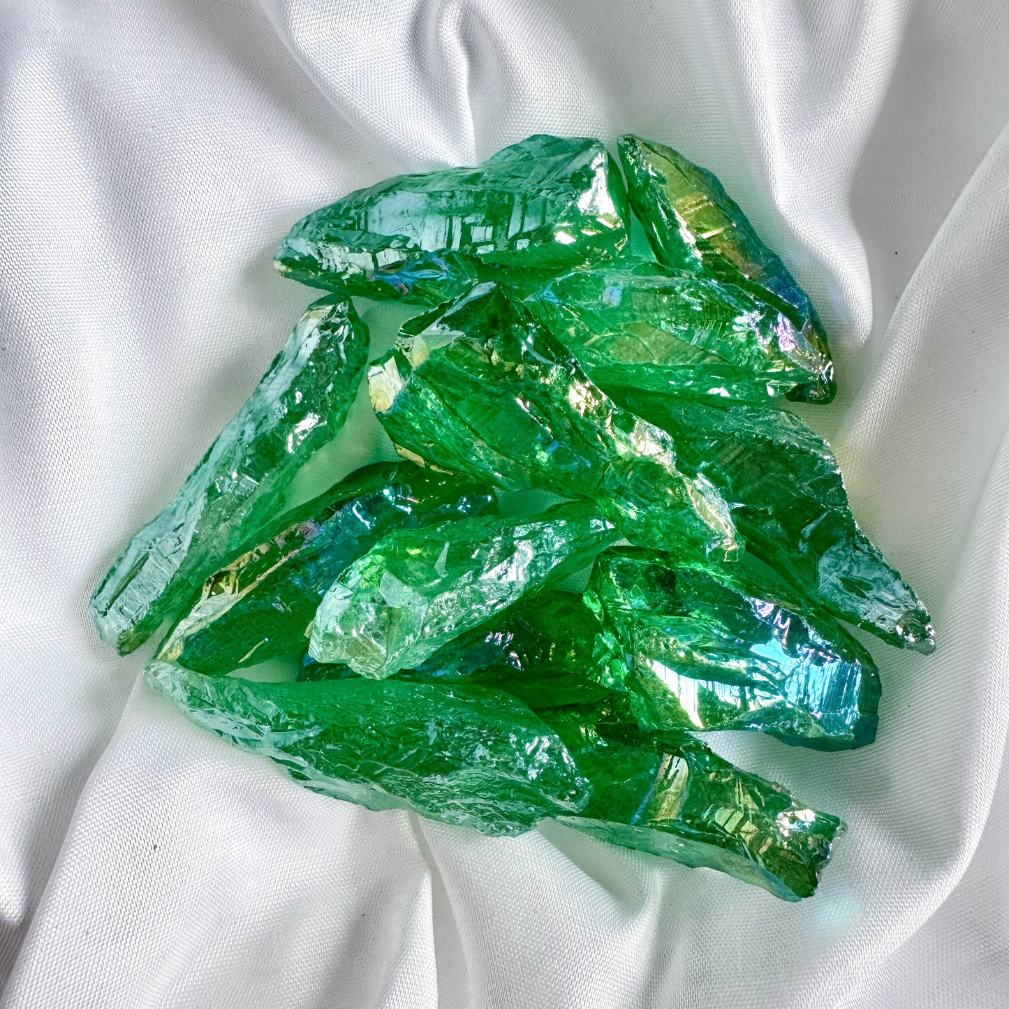 Green Angel Aura Quartz, created by bonding quartz with metals, brings tranquility and enhances spiritual awareness.