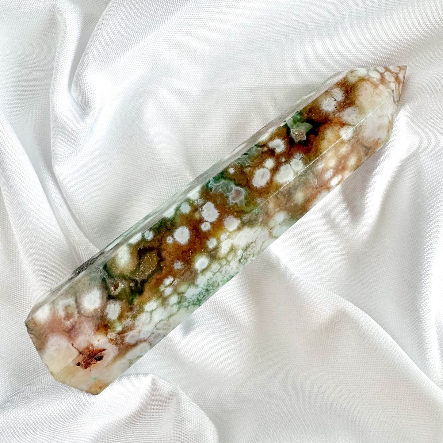 The Green Flower Agate Tower is a beautiful symbol of harmony and growth. Green Flower Agate is known for its nurturing properties, promoting emotional healing and personal transformation.