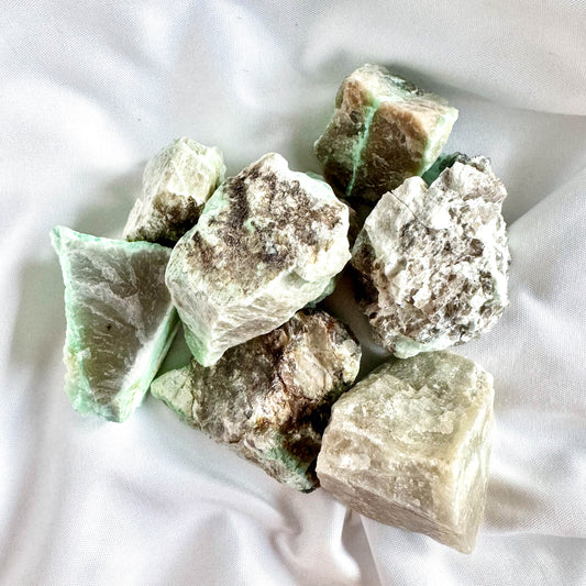 Green Moonstone is associated with the heart chakra and is known for its fertility-enhancing properties.