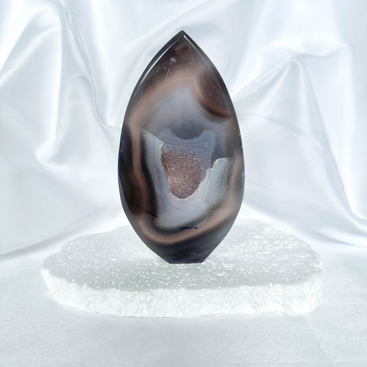 healing crystal gifts for her - GreyBandedAgate-Flame_Druzy_-Crystal Qi - Grey Banded Agate provides strength and support during challenging times. It enhances self-control and stimulates wise decision-making. The flame shape signifies transformation, allowing Grey Banded Agate to channel its supportive energy dynamically. 