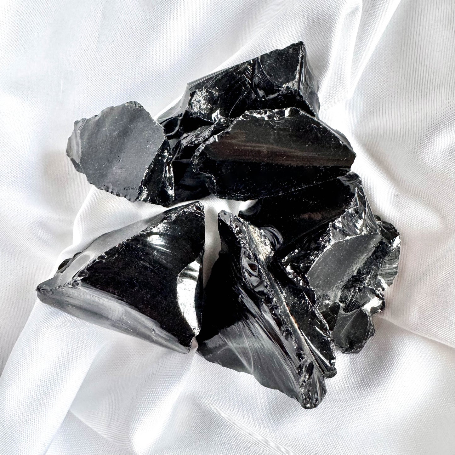 Obsidian is a powerful protective stone that shields against negativity. It also promotes emotional healing and clarity.