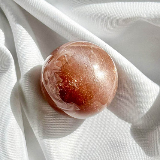 Peach Moonstone is a nurturing stone that enhances intuition, inner strength, and emotional balance. In sphere form, it radiates calming energy evenly, ideal for holistic healing and emotional support.