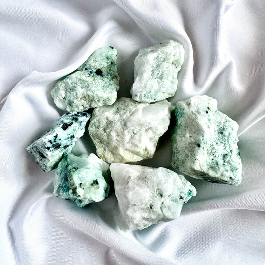 Phoenix Stone is a combination of malachite, chrysocolla, and turquoise, promoting transformation and emotional balance.