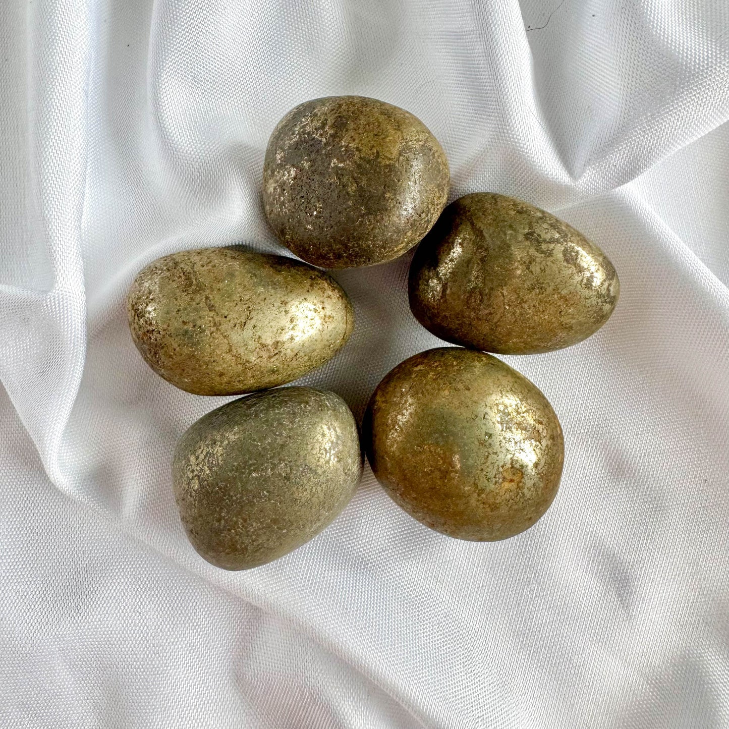 Pyrite Tumble Stone is known for its powerful protective and abundant energy. It promotes confidence, strength, and vitality while enhancing focus and determination.