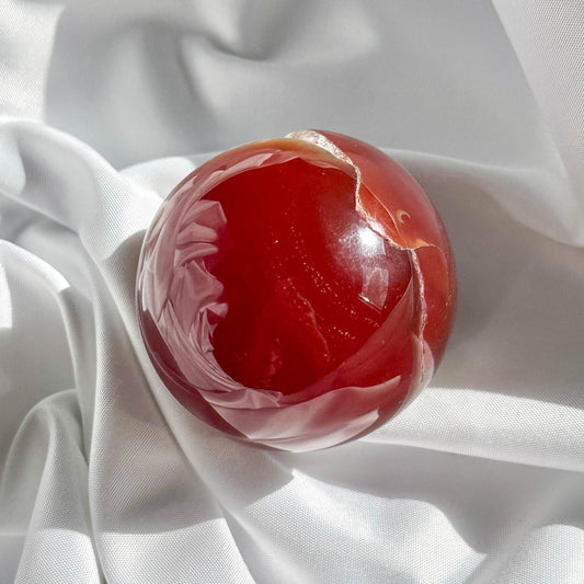 Red Agate Druzy is a grounding stone that enhances courage, strength, and emotional balance. In sphere form, it radiates nurturing energy evenly, ideal for holistic healing.