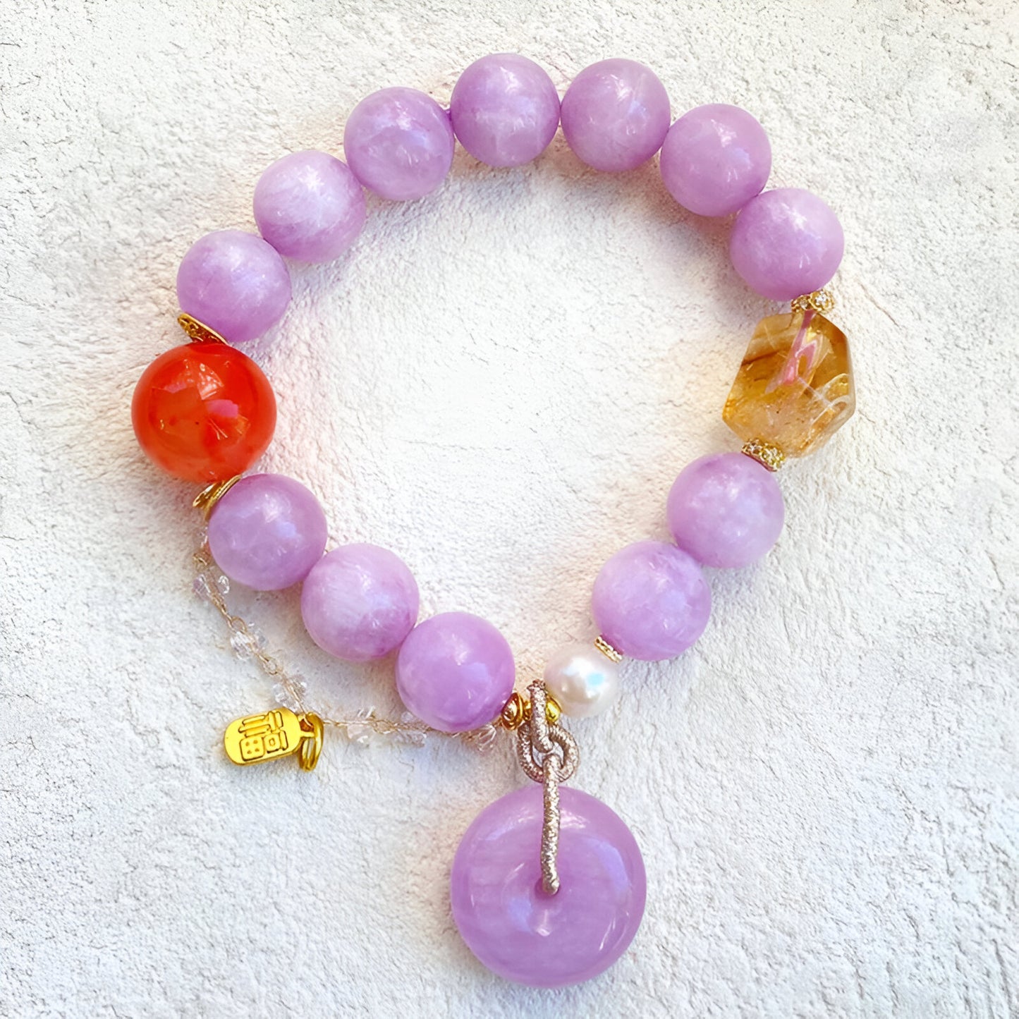 Introducing our Peace and Happiness Bracelet, a radiant combination of Kunzite, Citrine, and Carnelian crystals carefully curated to bring joy and positivity into your life.