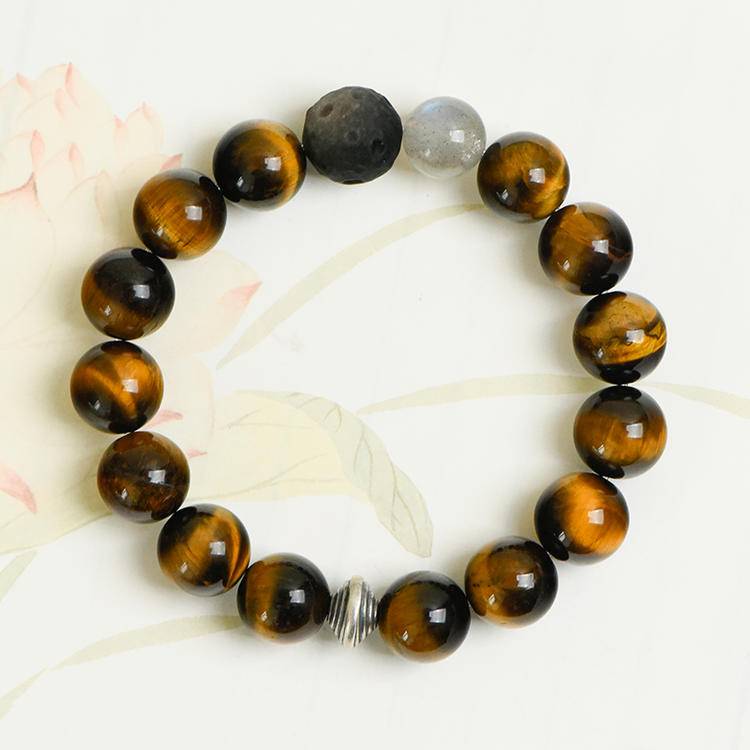 tigers eye and silver sheen obsidian beaded bracelet on a white background